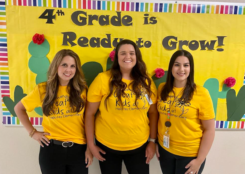 Pic of Fourth grade team in front of fourth grade bulletin board